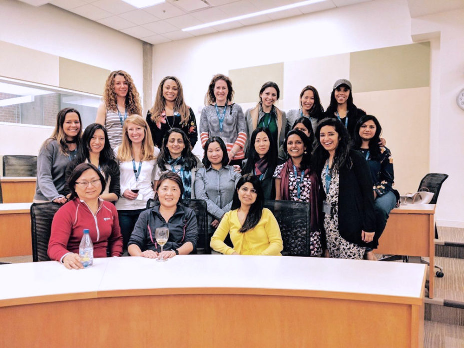 Swati with a group of women posing in a lecture hall