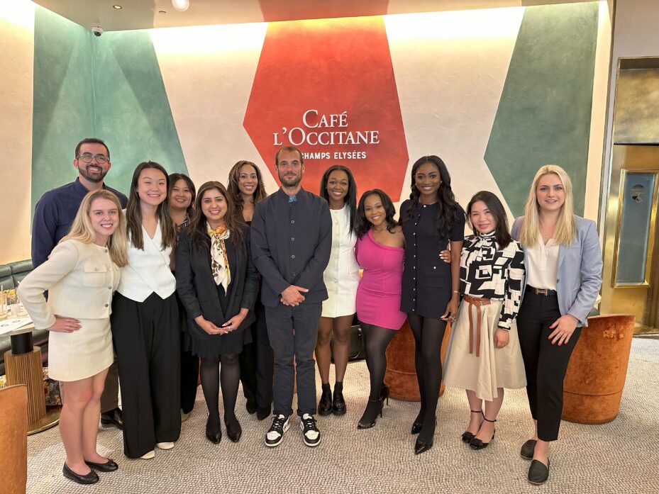 A group of MBA students at L'Occitane headquarters with Managing Director Julien Schneider.