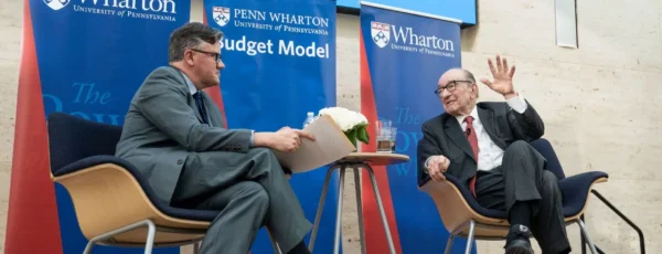 Prof. Kent Smetters in conversation with former Federal Reserve Chairman Alan Greenspan at Perry World House in 2019 (Image Credit: Wharton Alumni Magazine)