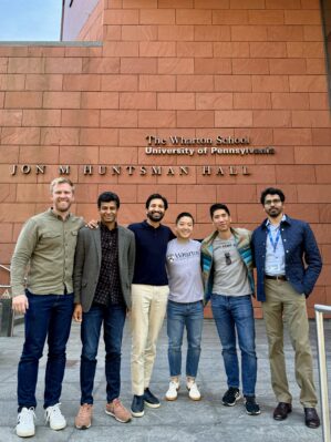 Brad Mears, WG’26 (far left), with classmates on Wharton’s Philadelphia campus (Image Credit: Aansh Jarmarwala)